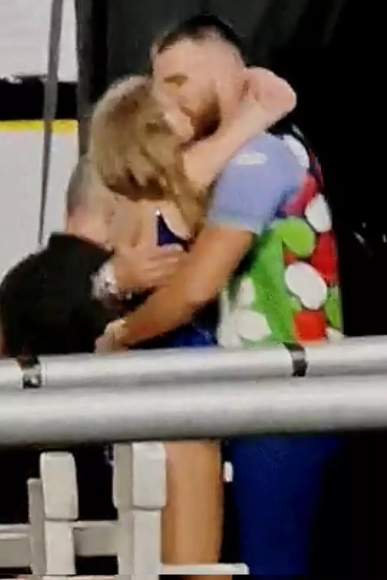 Following her performance in Argentina, Taylor Swift storms into Travis Kelce's arms and plants a kiss.