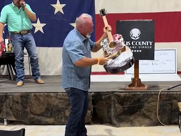 Guy bought a signed Taylor Swift guitar at a live auction for $4,000, only to destroy it