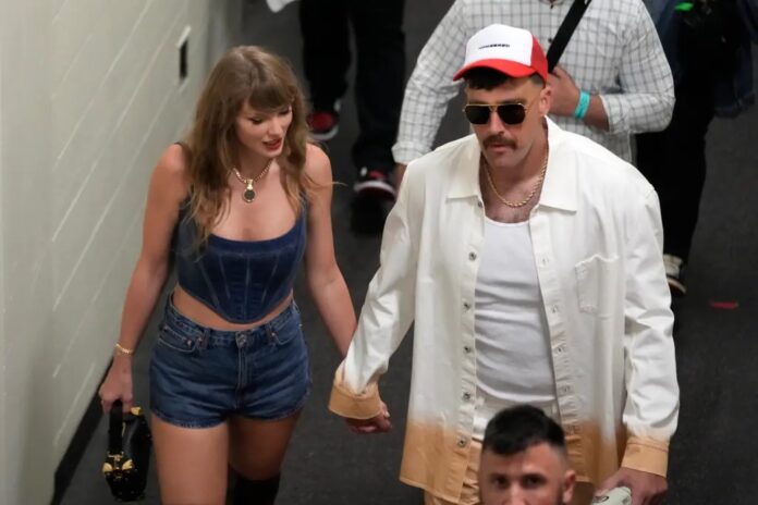 Travis Kelce and Taylor Swift leaving the stadium after the Chiefs win against Ravens