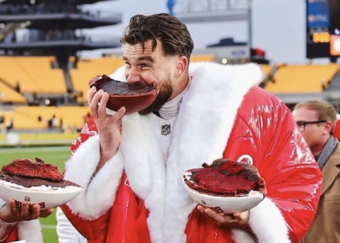 Travis Kelce eating cake